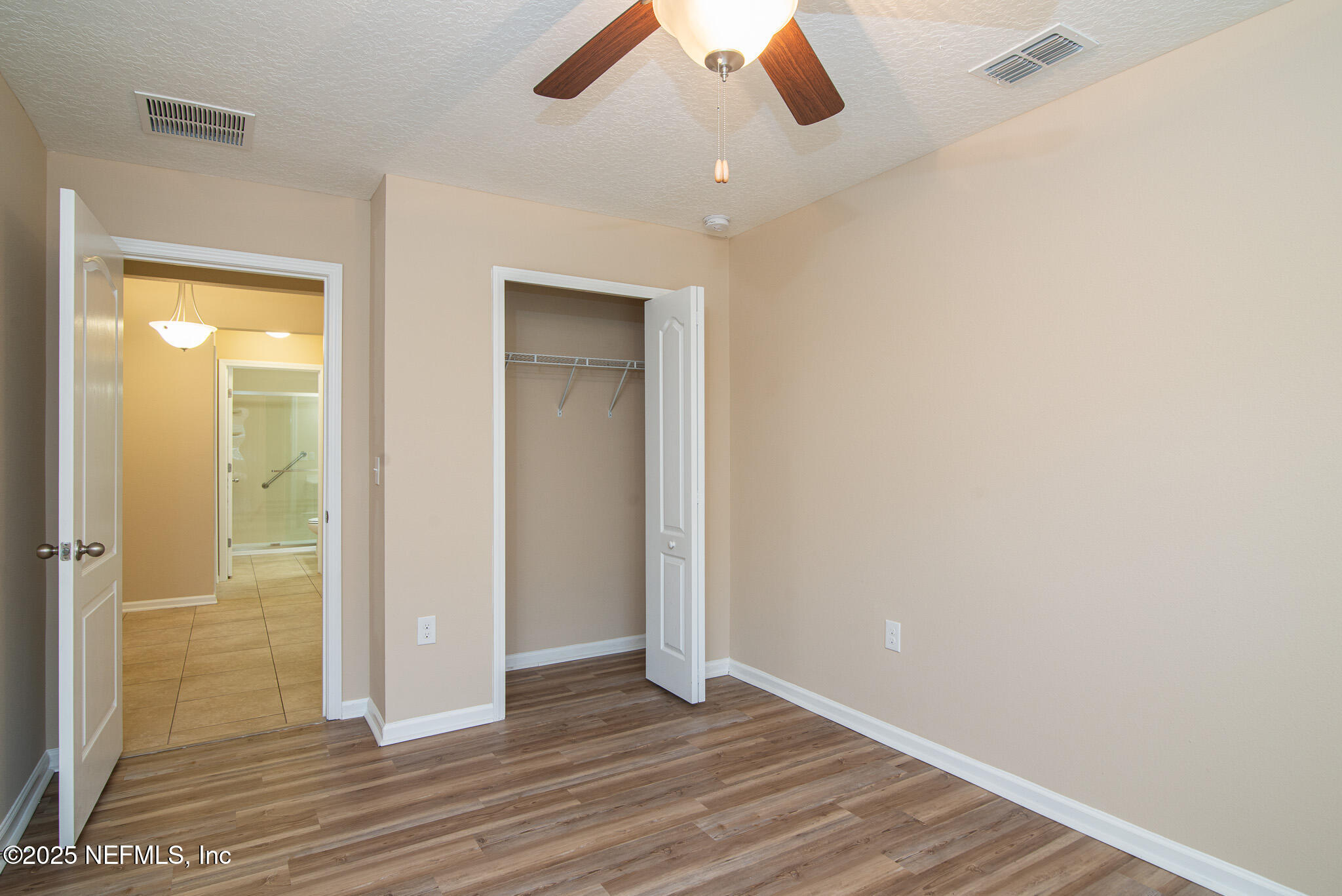 414 Samara Lakes Parkway St. Augustine, FL 32092 - Photo 17 of 26 wooden floor in an empty room