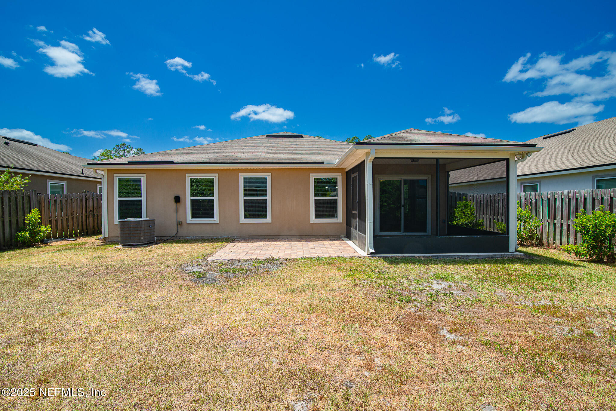 414 Samara Lakes Parkway St. Augustine, FL 32092 - Photo 22 of 26 a backyard of a house with yard and outdoor seating