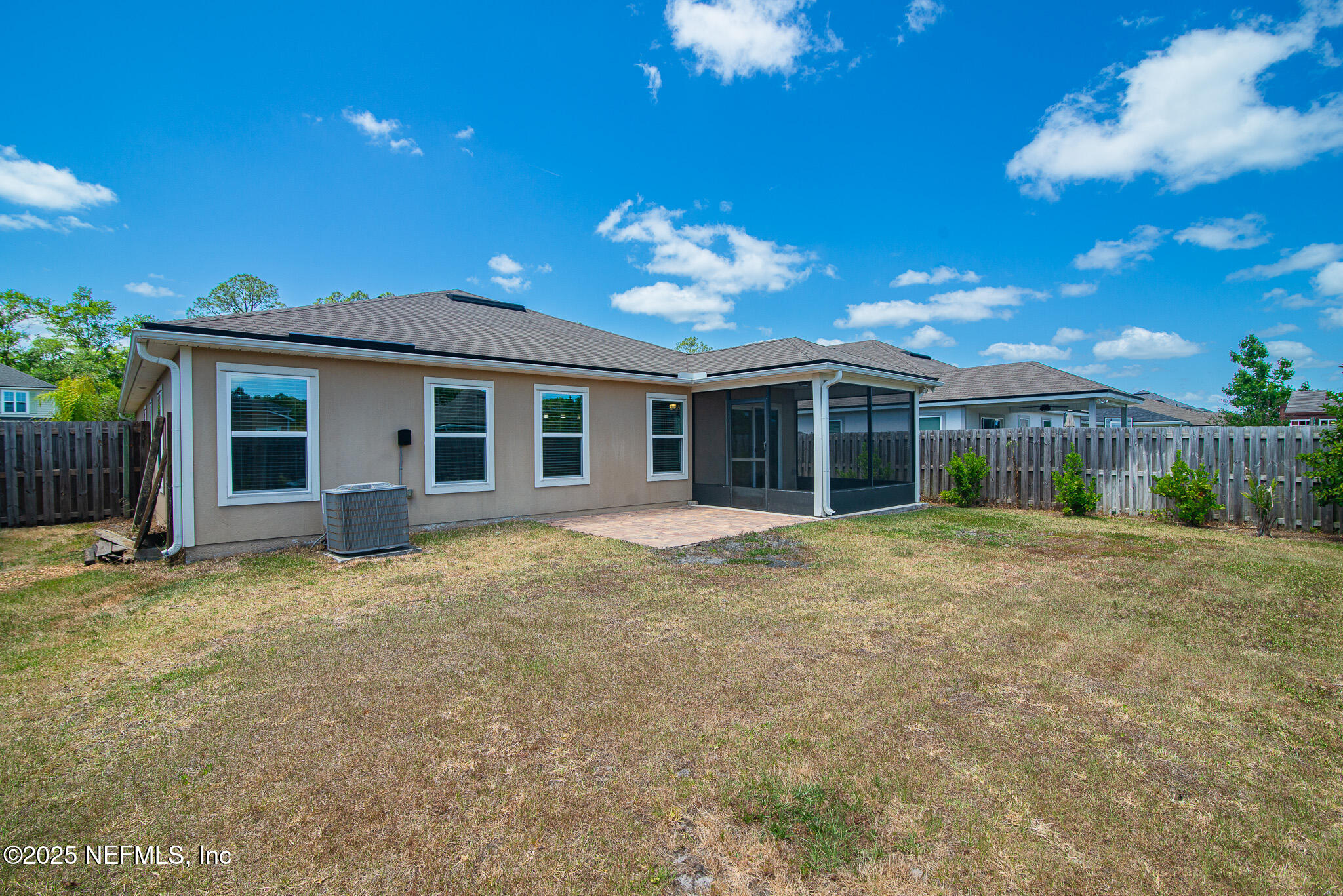 414 Samara Lakes Parkway St. Augustine, FL 32092 - Photo 23 of 26 a view of a house with a yard and potted plants