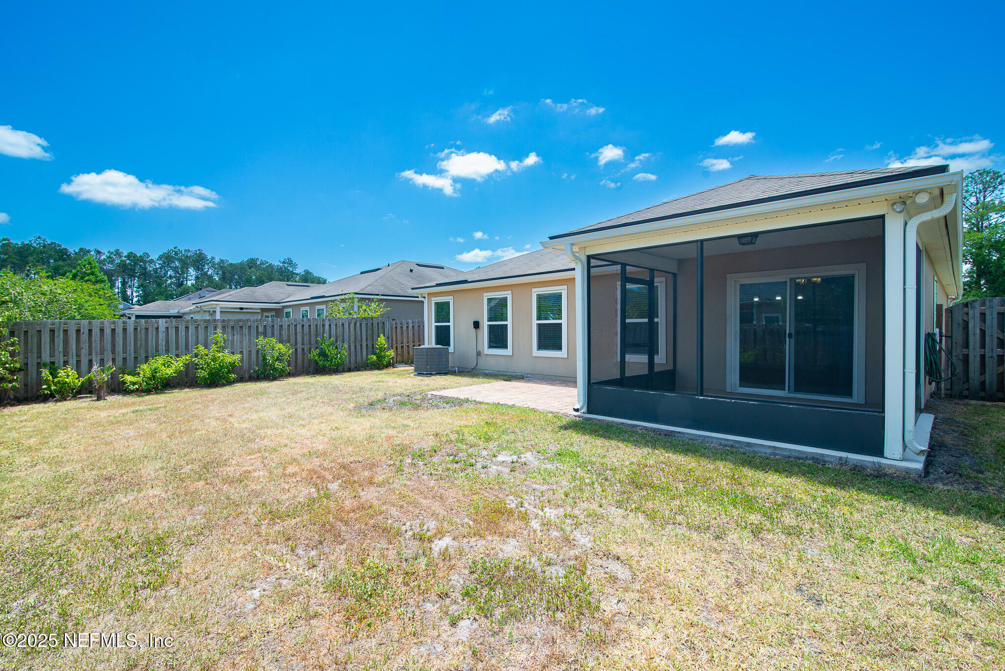 414 Samara Lakes Parkway St. Augustine, FL 32092 - Photo 24 of 26 front view of a house with a yard
