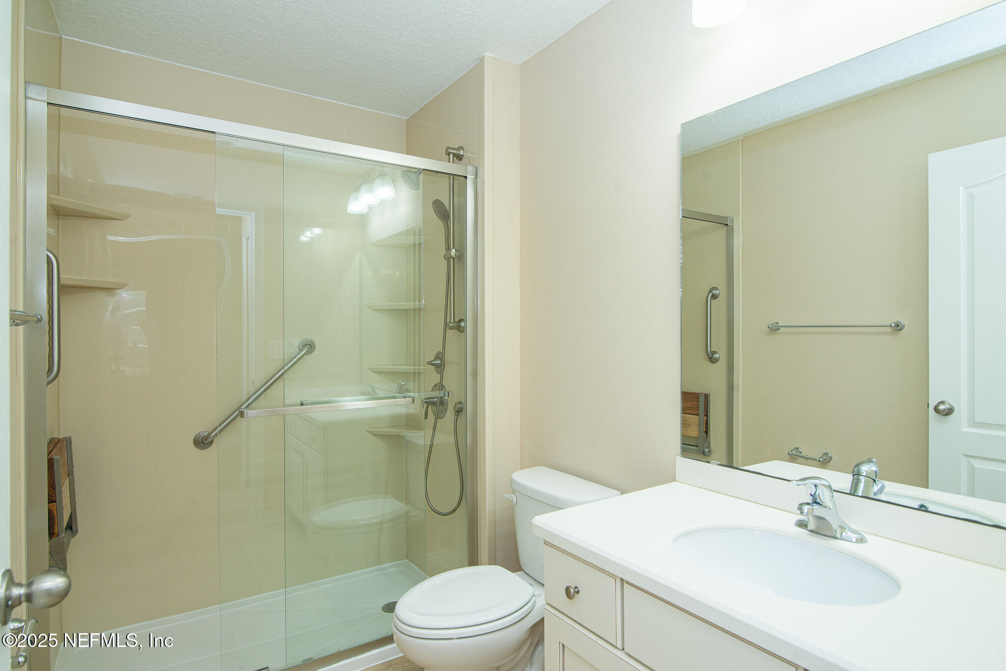 414 Samara Lakes Parkway St. Augustine, FL 32092 - Photo 8 of 26 a bathroom with a sink mirror shower and toilet