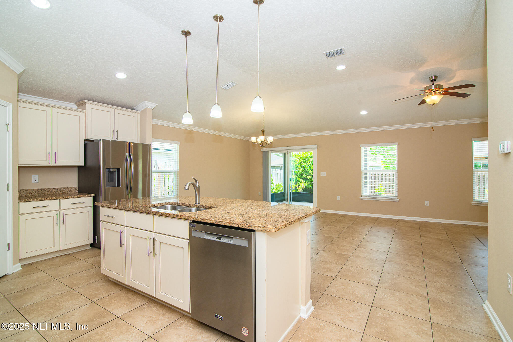 414 Samara Lakes Parkway St. Augustine, FL 32092 - Photo 9 of 26 a kitchen with a sink stove and refrigerator