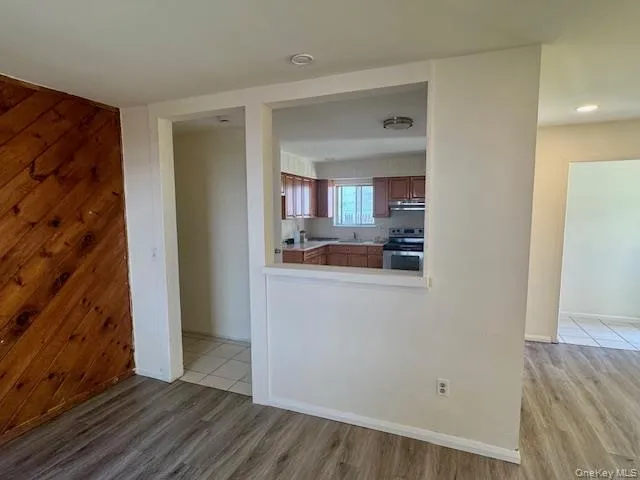 a view of a kitchen cabinets and wooden floor