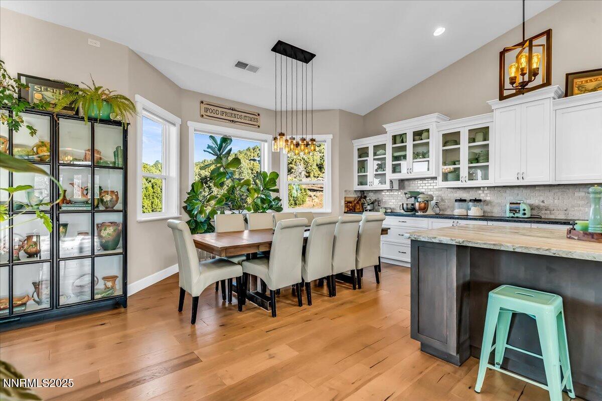 4610 Tybo Road Reno, NV 89521 - Photo 11 of 47 a living room with furniture dining table and a large window