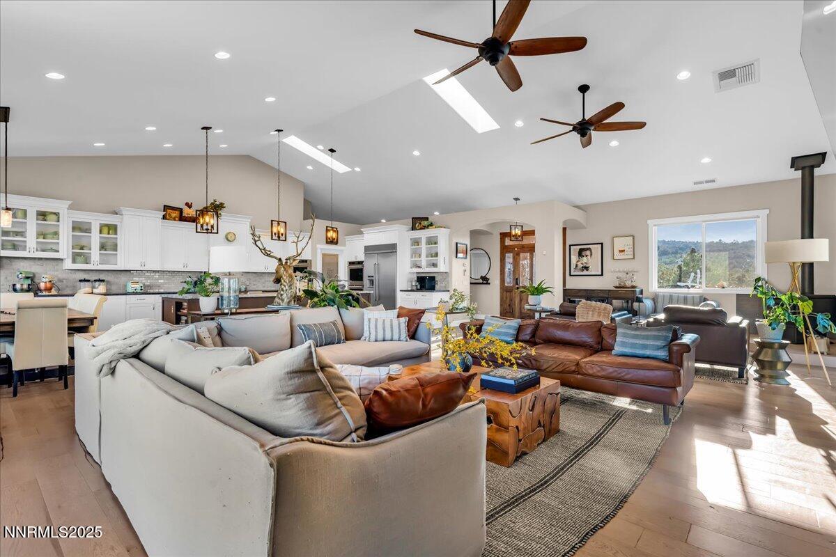 4610 Tybo Road Reno, NV 89521 - Photo 15 of 47 a living room with furniture kitchen view and a wooden floor
