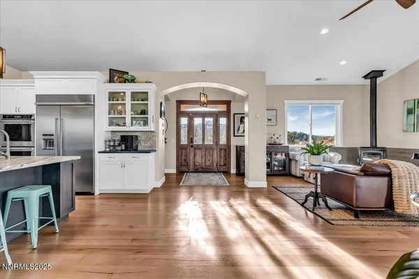 a living room with furniture window and wooden floor