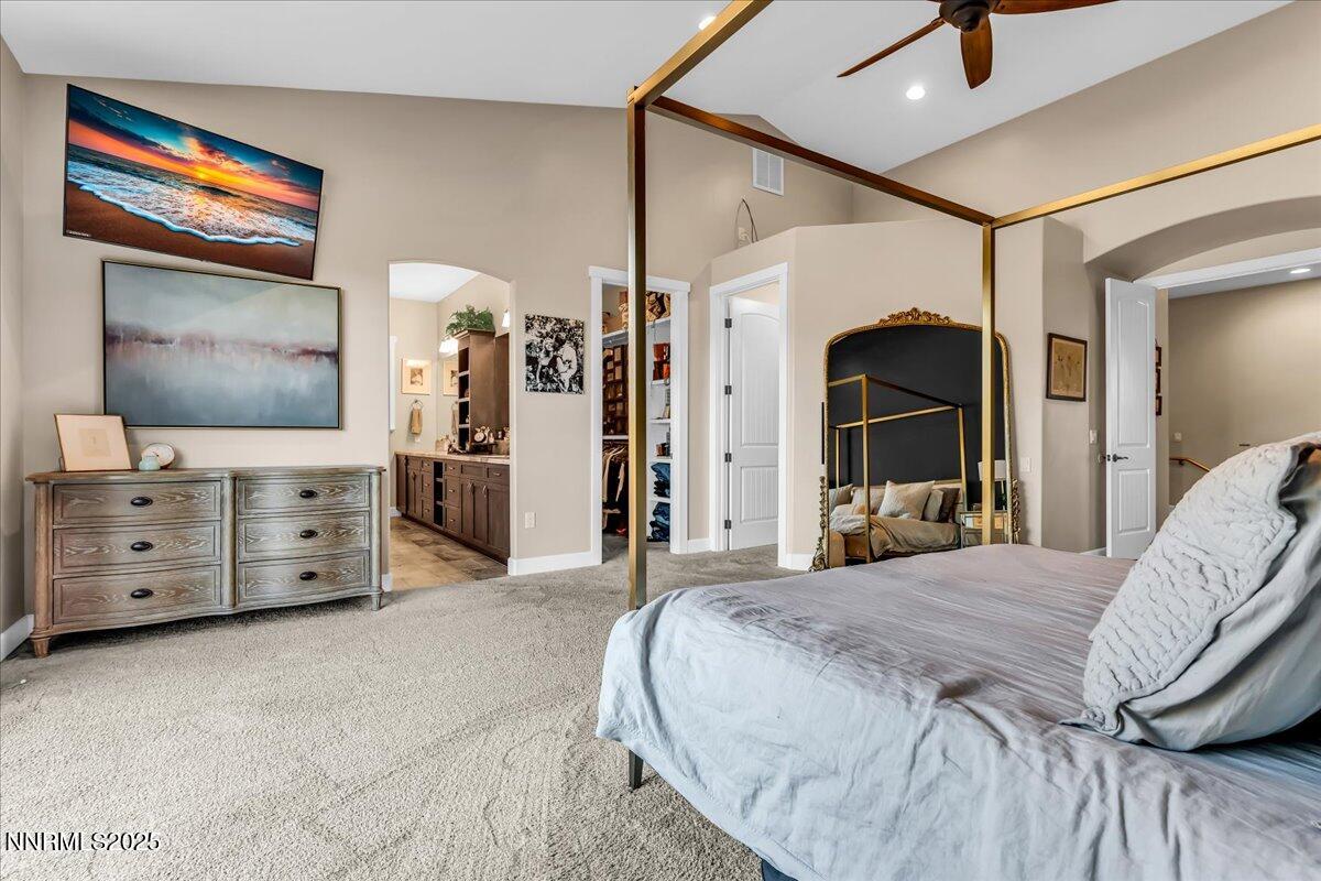 4610 Tybo Road Reno, NV 89521 - Photo 19 of 47 a bedroom with a bed and a flat screen tv