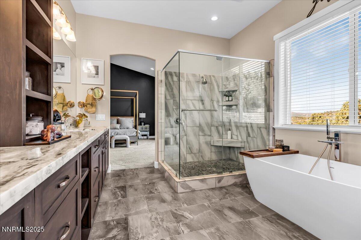 4610 Tybo Road Reno, NV 89521 - Photo 20 of 47 a large white kitchen with a granite countertop sink and a large window