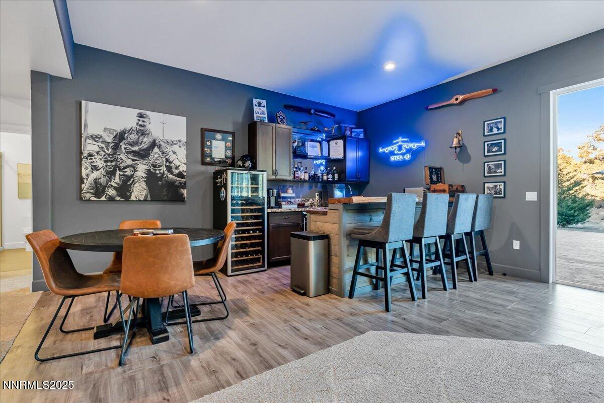 4610 Tybo Road Reno, NV 89521 - Photo 27 of 47 a view of a dining room with furniture and wooden floor