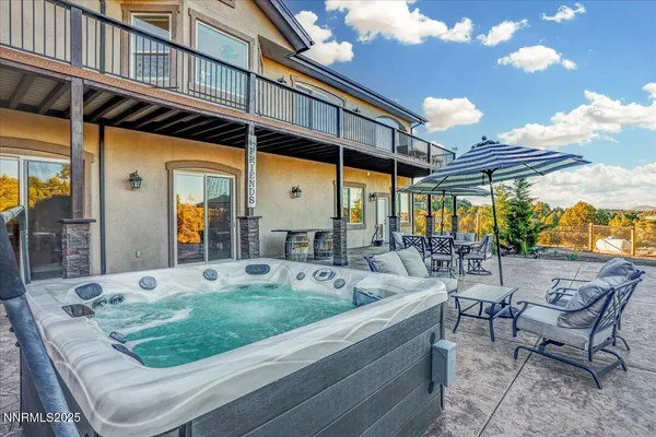 a view of a patio with couches table and chairs