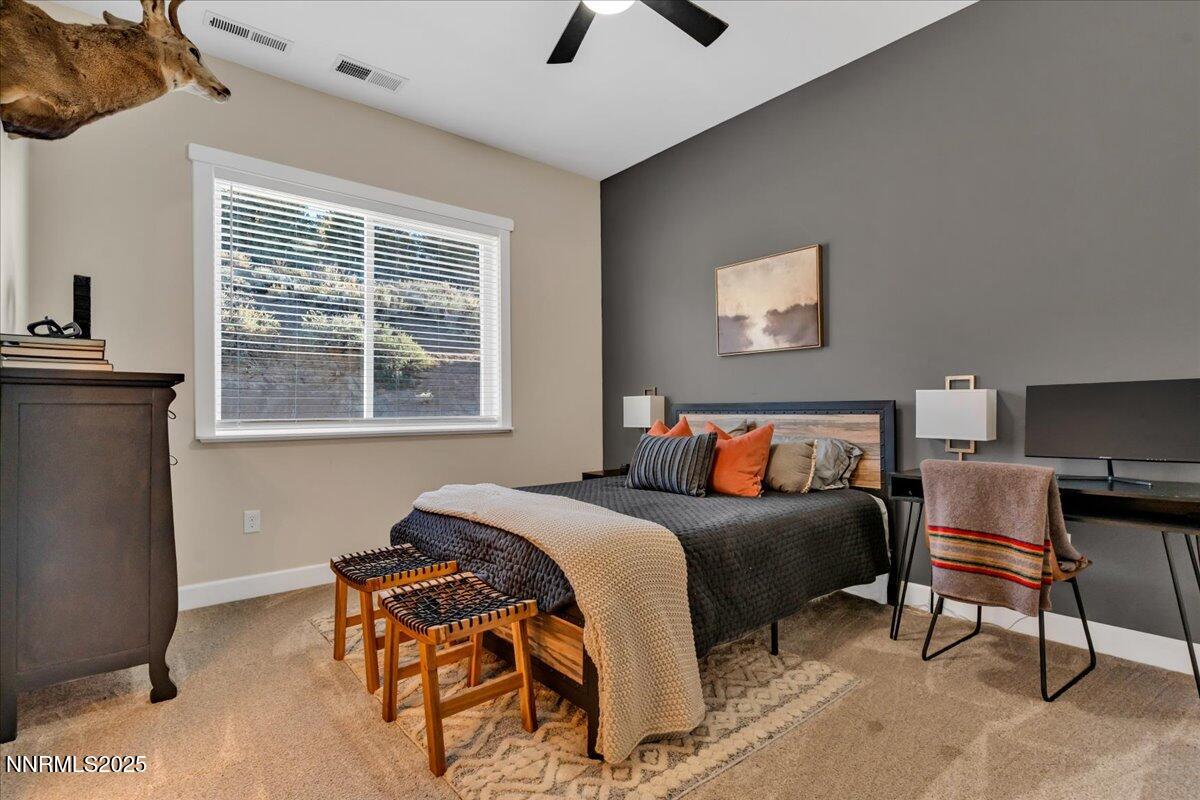 4610 Tybo Road Reno, NV 89521 - Photo 36 of 47 a bedroom with a bed and a window