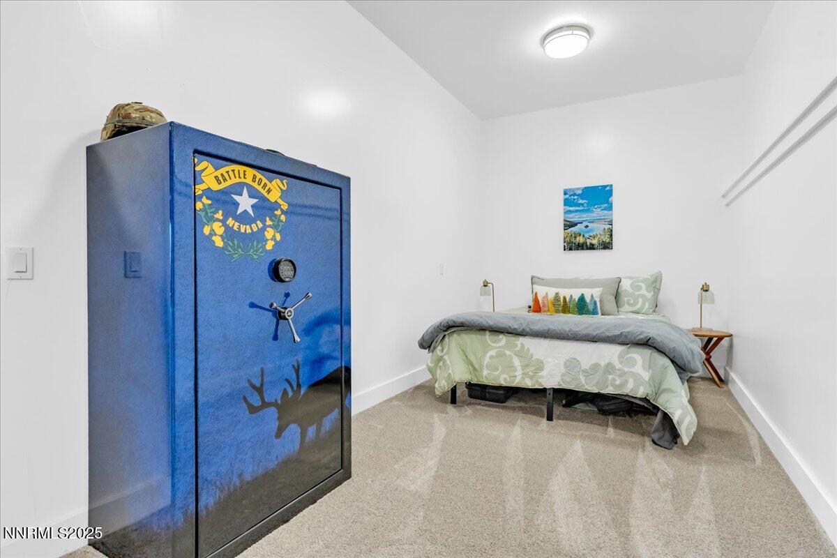 4610 Tybo Road Reno, NV 89521 - Photo 38 of 47 a bedroom with a bed and a painting on the wall