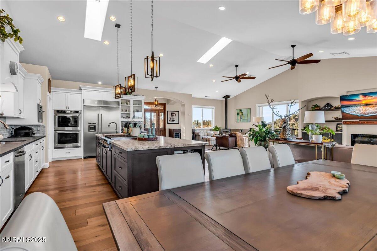 4610 Tybo Road Reno, NV 89521 - Photo 8 of 47 a large kitchen with lots of counter space and stainless steel appliances