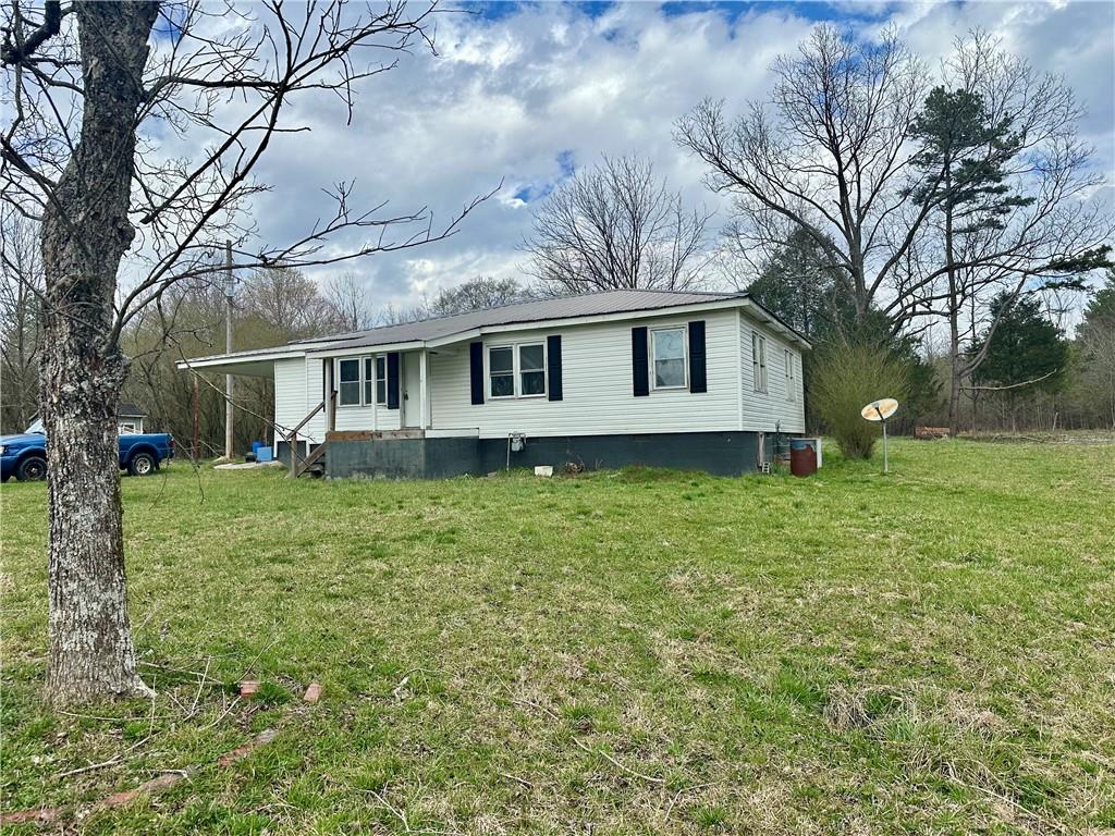 456 Cummings Road Trion, GA 30753 - Photo 2 of 13 a front view of house with yard and green space