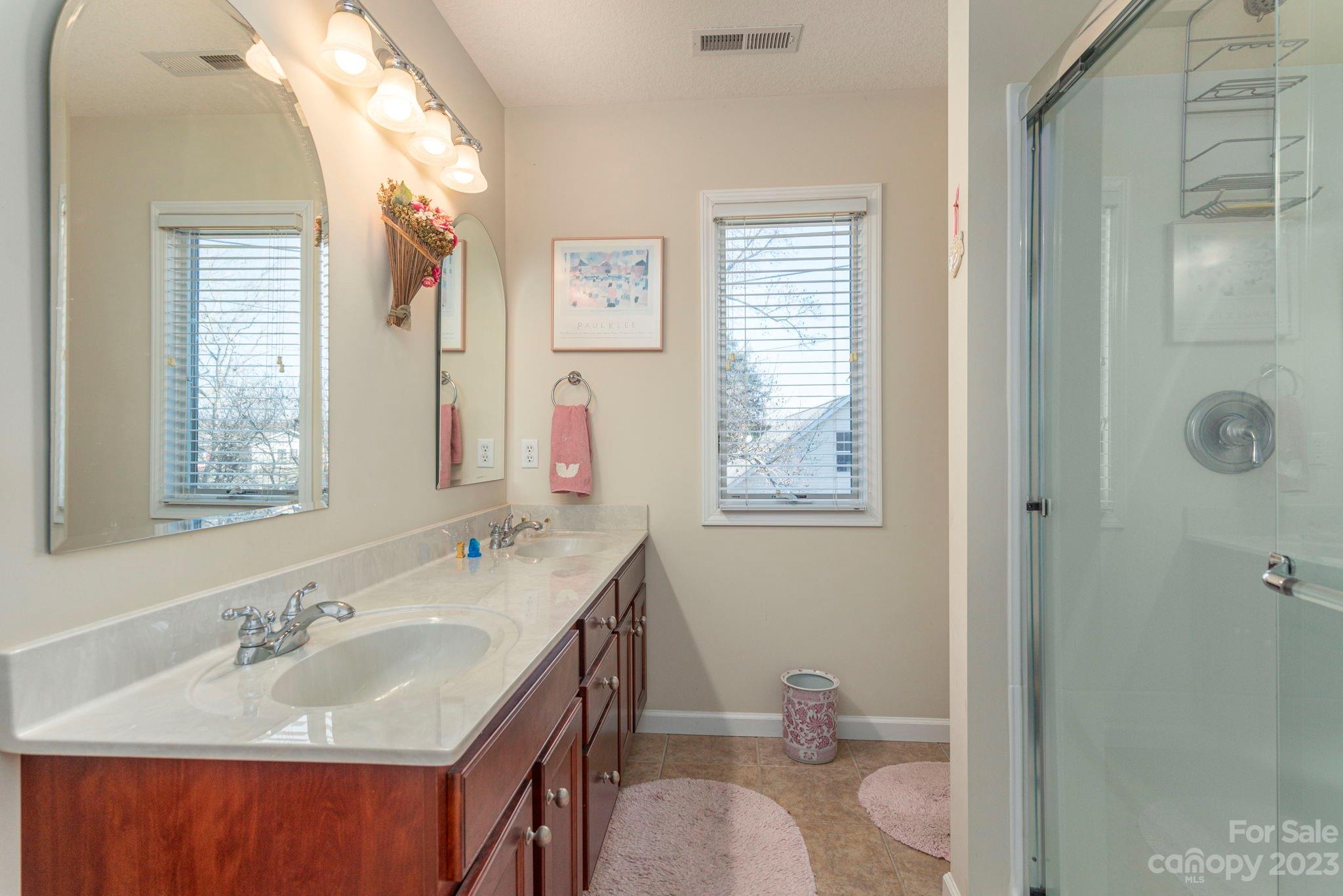 448 Kyfields Weaverville, NC 28787 - Photo 21 of 25 a bathroom with a granite countertop sink toilet and shower