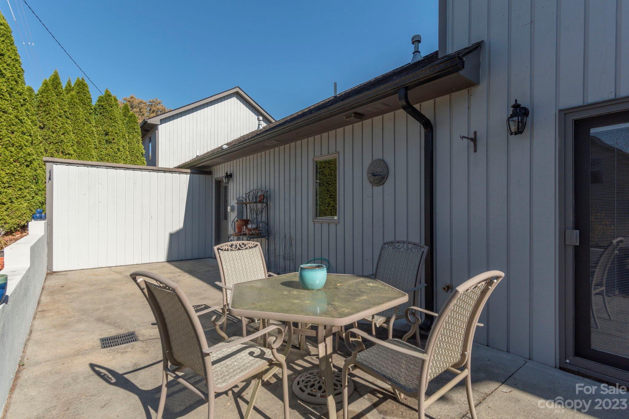 448 Kyfields Weaverville, NC 28787 - Photo 23 of 25 a backyard of a house with table and chairs