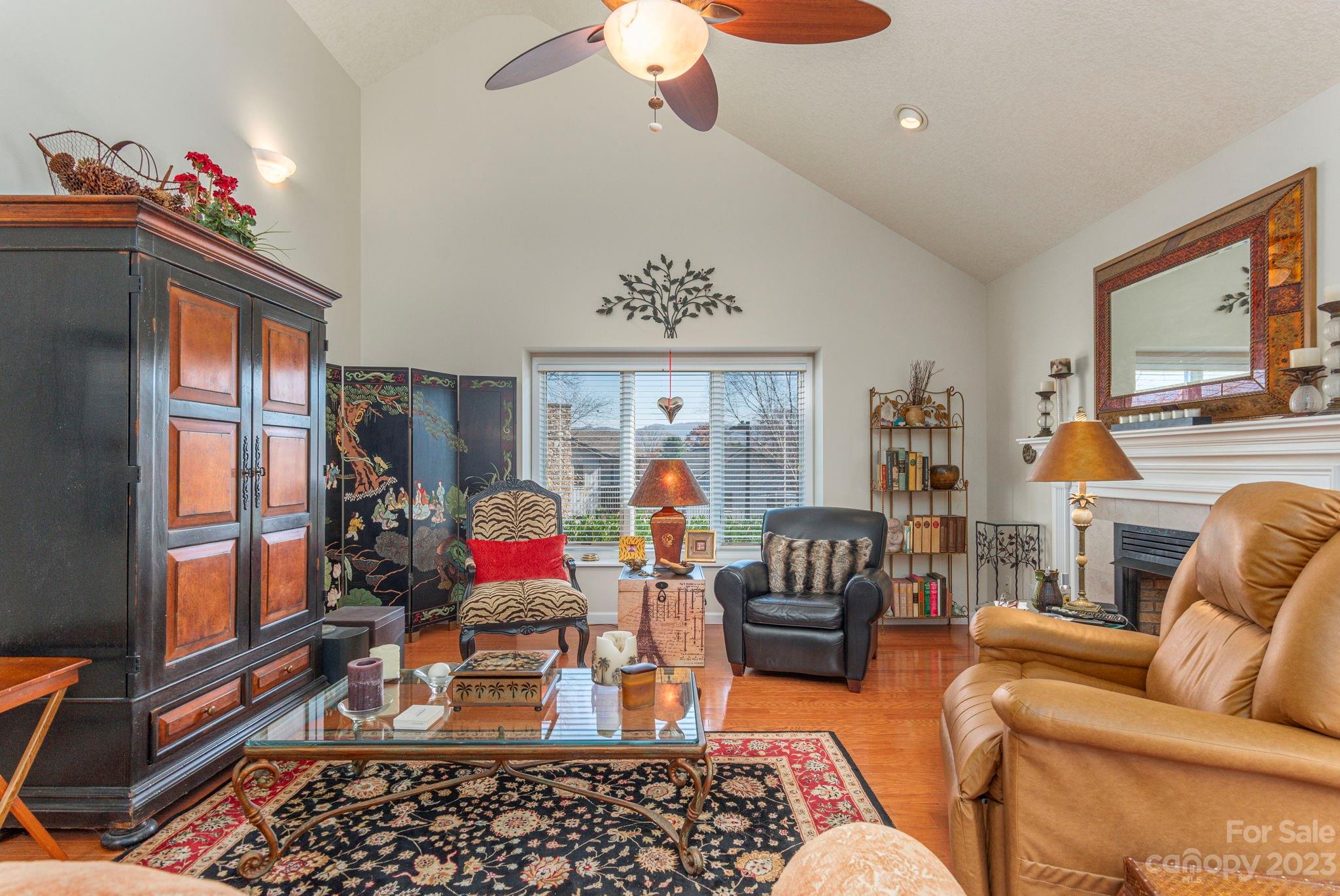 448 Kyfields Weaverville, NC 28787 - Photo 5 of 25 a living room with furniture a chandelier and a window