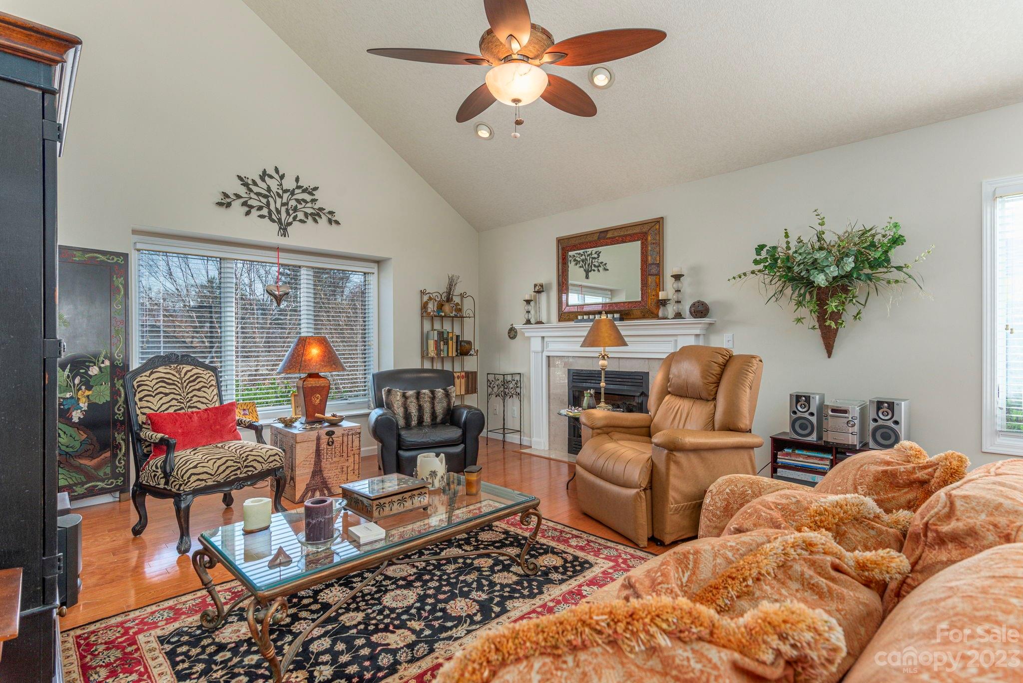 448 Kyfields Weaverville, NC 28787 - Photo 7 of 25 a living room with furniture a chandelier and a window