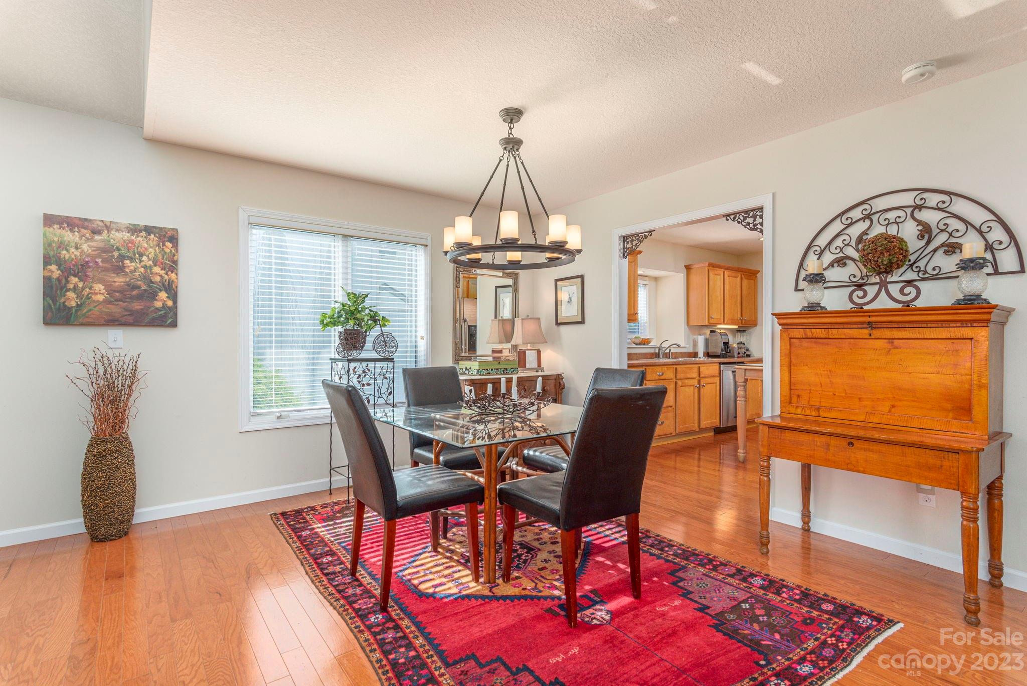 448 Kyfields Weaverville, NC 28787 - Photo 10 of 25 a view of a dining room with furniture window and wooden floor