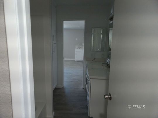 209 South Fire Opal Street Ridgecrest, CA 93555 - Photo 15 of 23 a bathroom with a glass shower door
