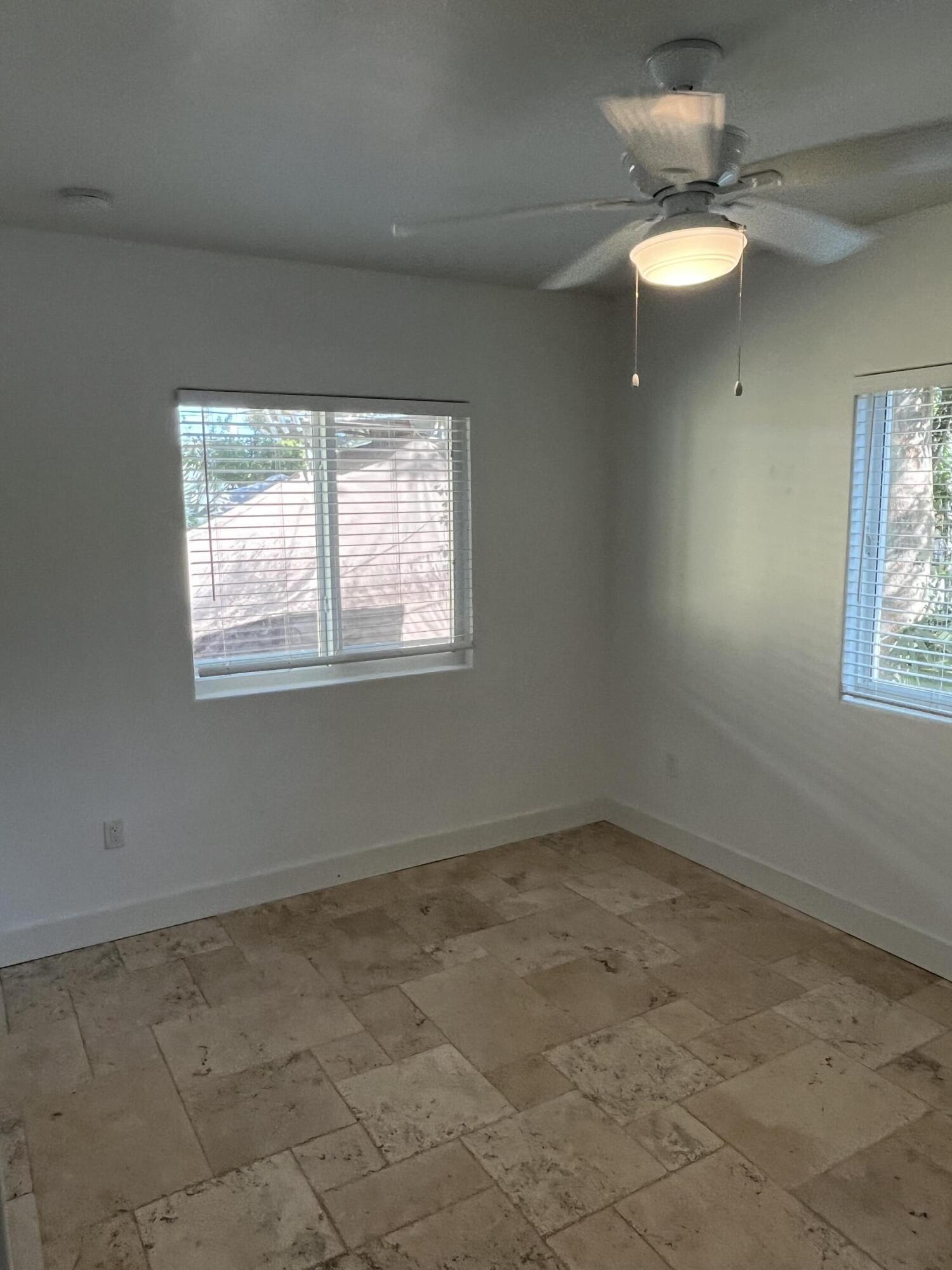 639 Cabrera Street Key Largo, FL 33037 - Photo 23 of 24 an empty room with windows and fan