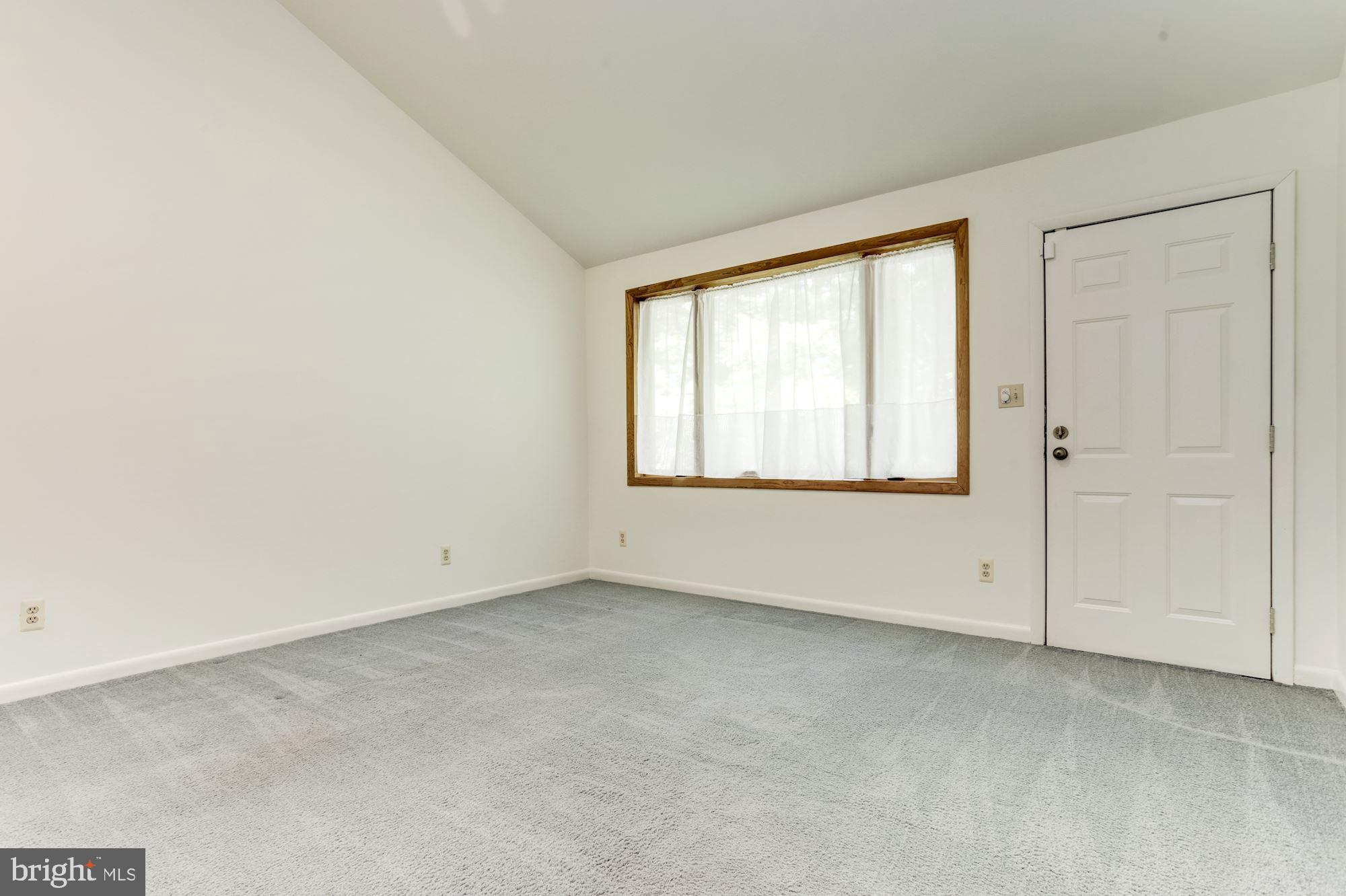 4511 Clifton Road Baltimore, MD 21216 - Photo 14 of 35 an empty room with a window