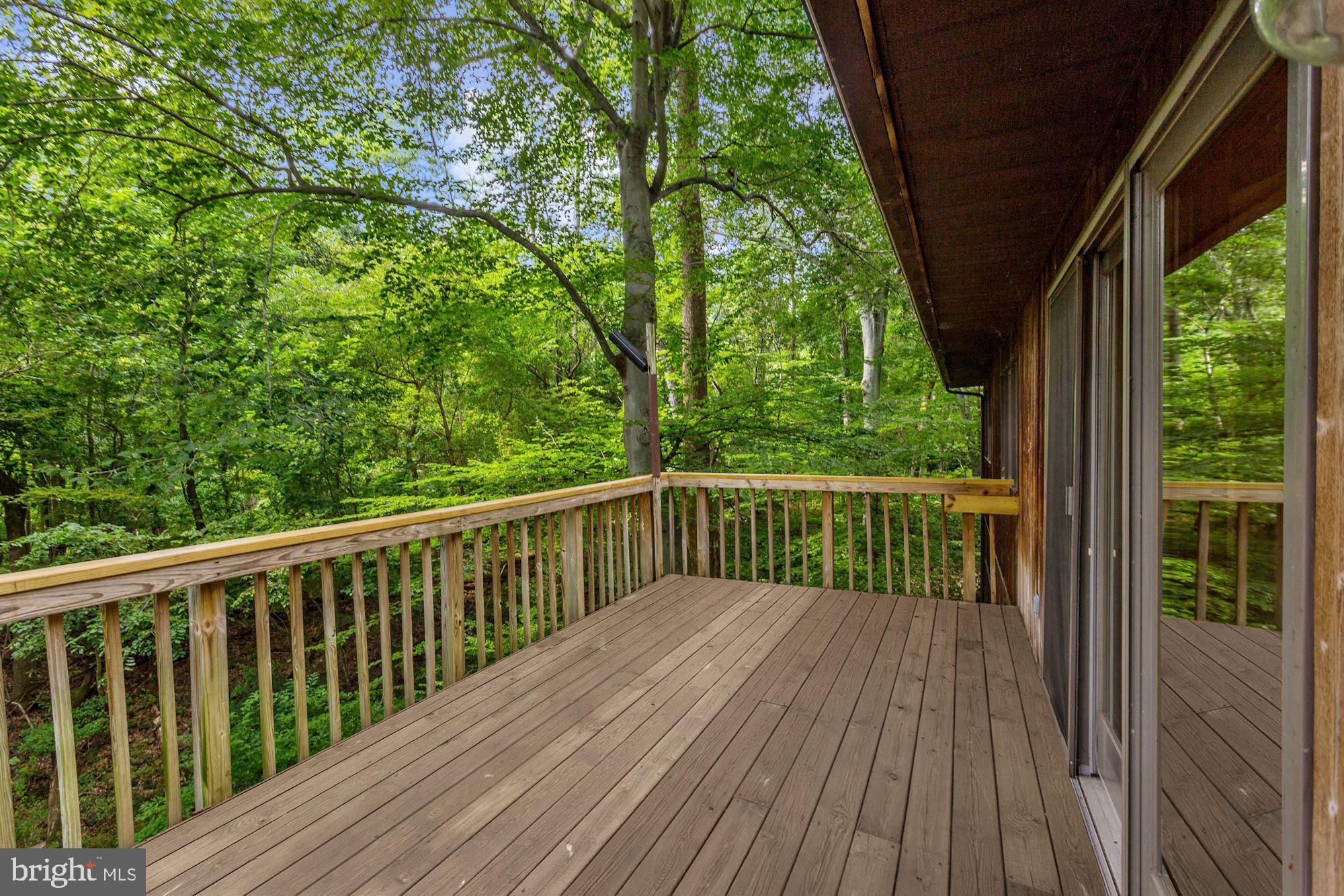 4511 Clifton Road Baltimore, MD 21216 - Photo 29 of 35 a balcony with wooden floor and outdoor space