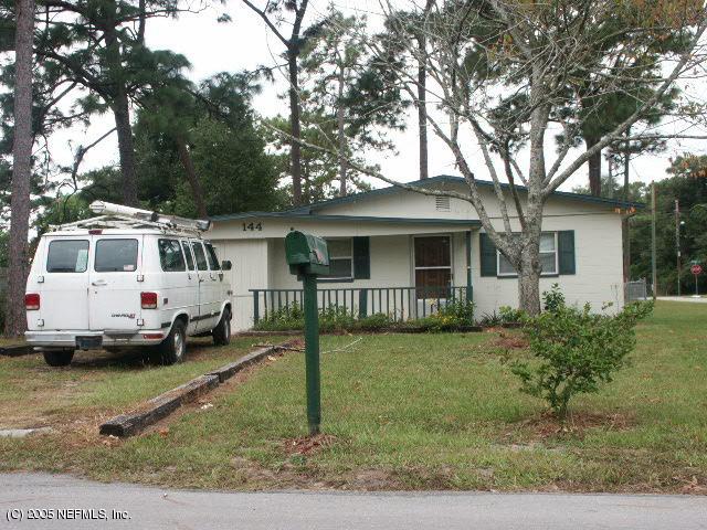 144 Lighthouse Road North Jacksonville, FL 32225 - Photo 1 of 1 a white house that has a tree in front of it