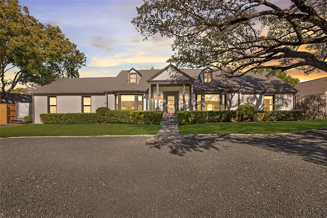 a view of house with a garden