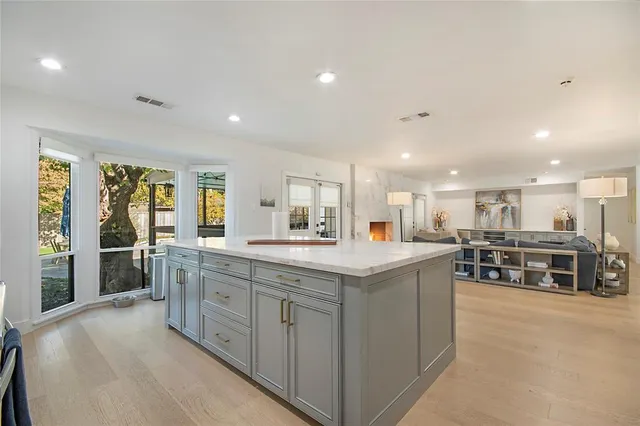 a view of a livingroom with workspace and a window