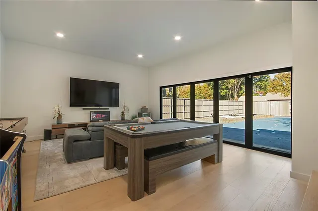 a bathroom with a granite countertop sink a toilet and shower