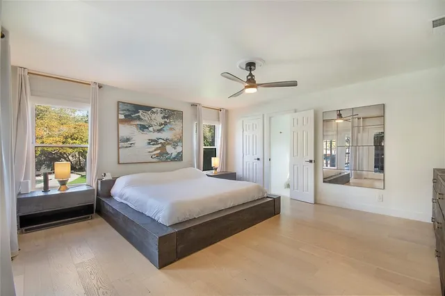a en suite bathroom with a double vanity sink and a mirror