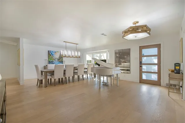 a view of a livingroom with furniture and a flat screen tv