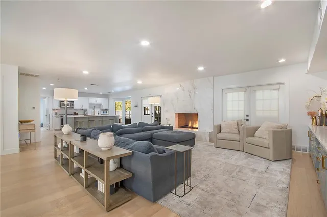 a kitchen with a sink stainless steel appliances and cabinets