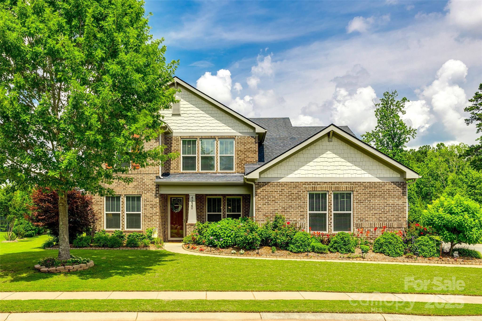 4220 Thames Circle Fort Mill, SC 29715 - Photo 1 of 44 a front view of a house with a yard