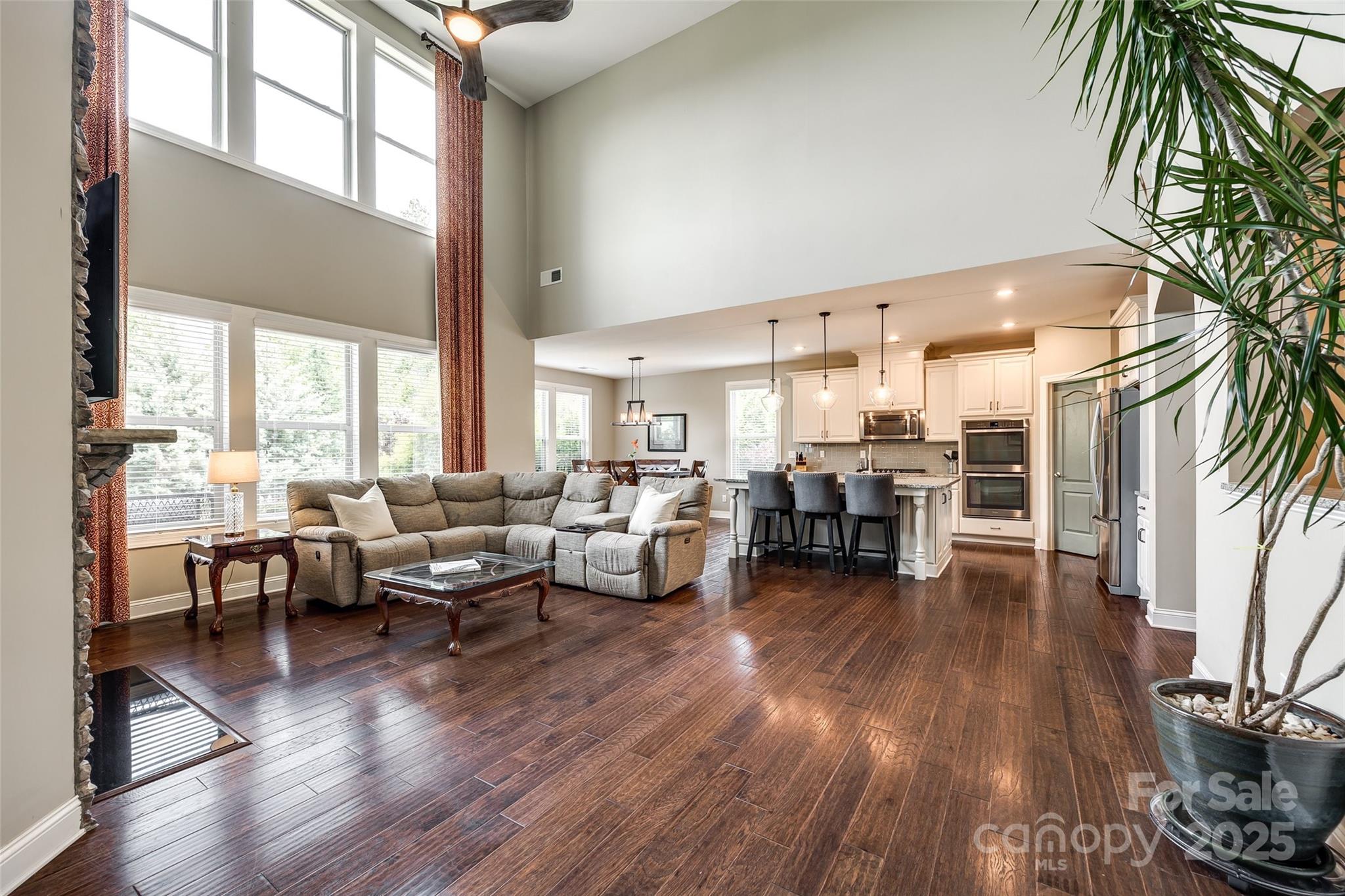 4220 Thames Circle Fort Mill, SC 29715 - Photo 11 of 44 a living room with furniture and a wooden floor