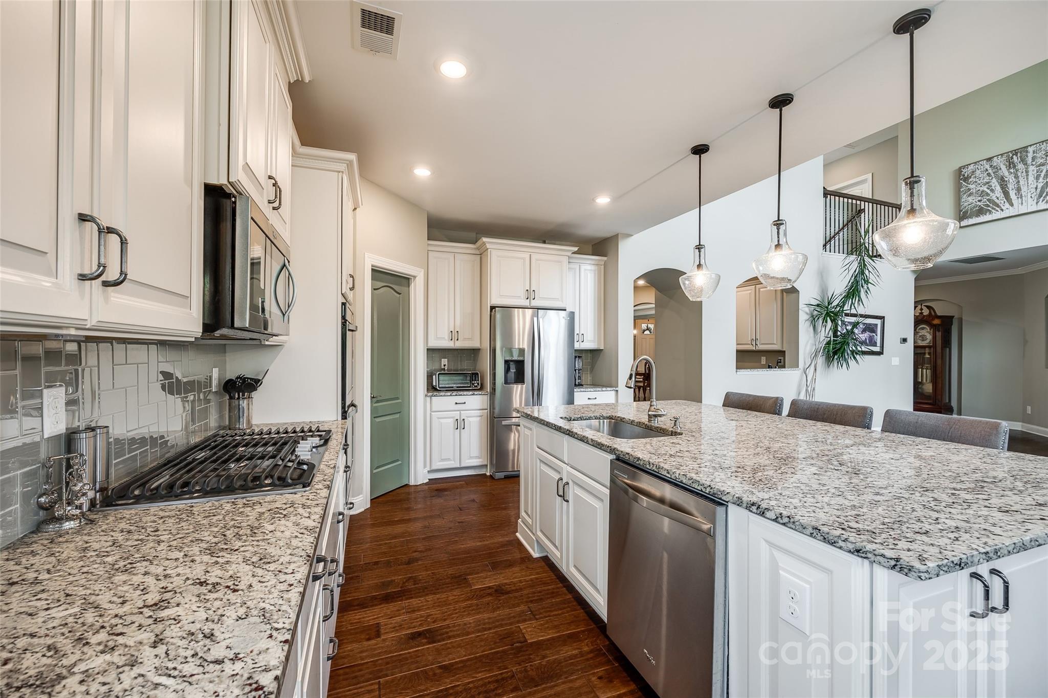 4220 Thames Circle Fort Mill, SC 29715 - Photo 15 of 44 a kitchen with stainless steel appliances granite countertop a sink stove and refrigerator