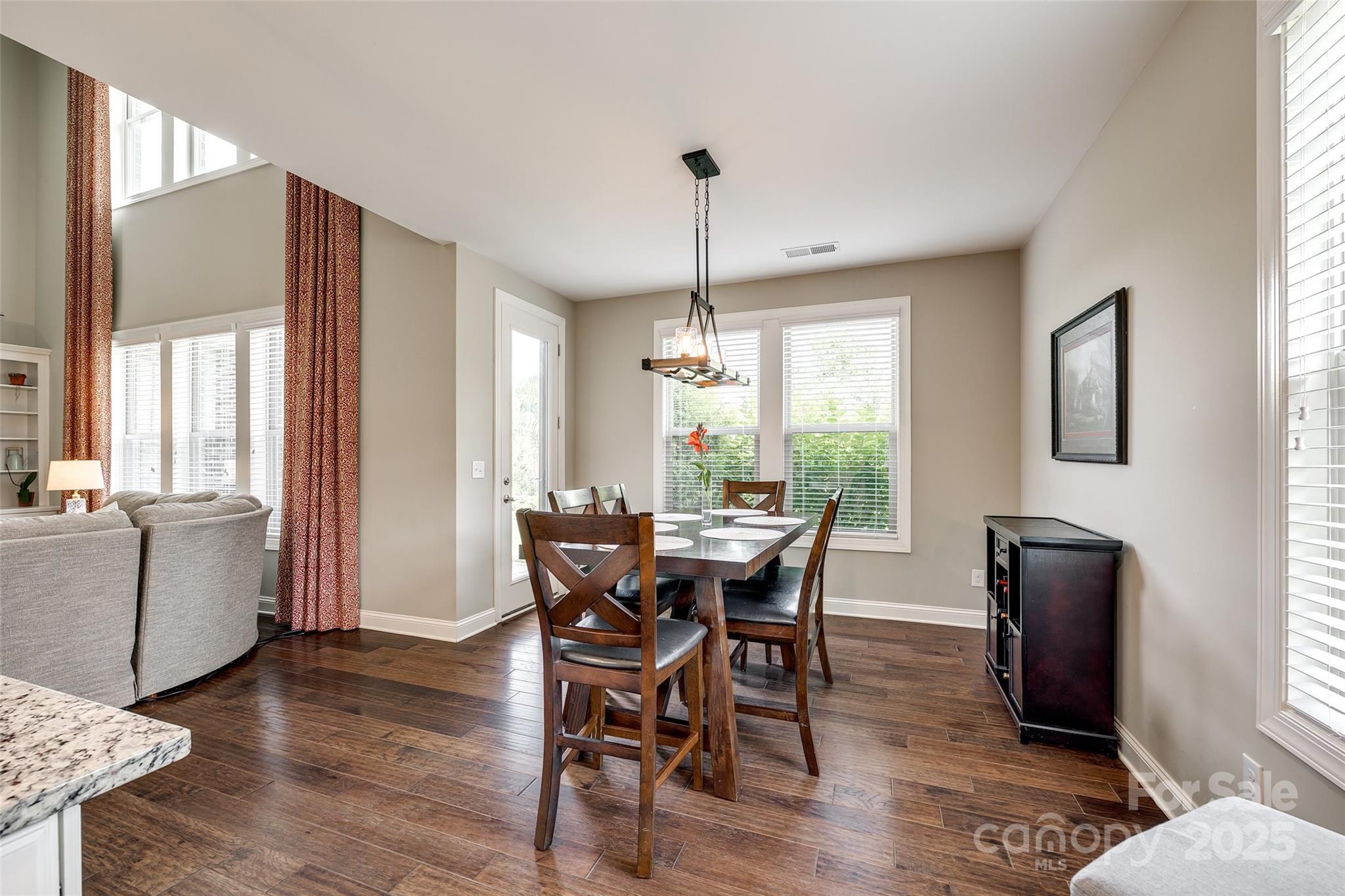 4220 Thames Circle Fort Mill, SC 29715 - Photo 16 of 44 a view of a dining room with furniture window and wooden floor