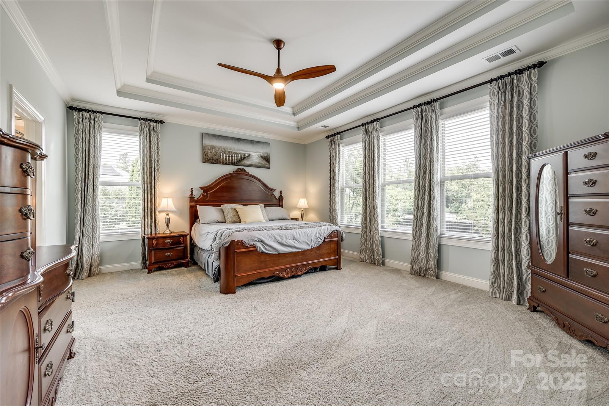 4220 Thames Circle Fort Mill, SC 29715 - Photo 17 of 44 a bedroom with a bed couch and a window