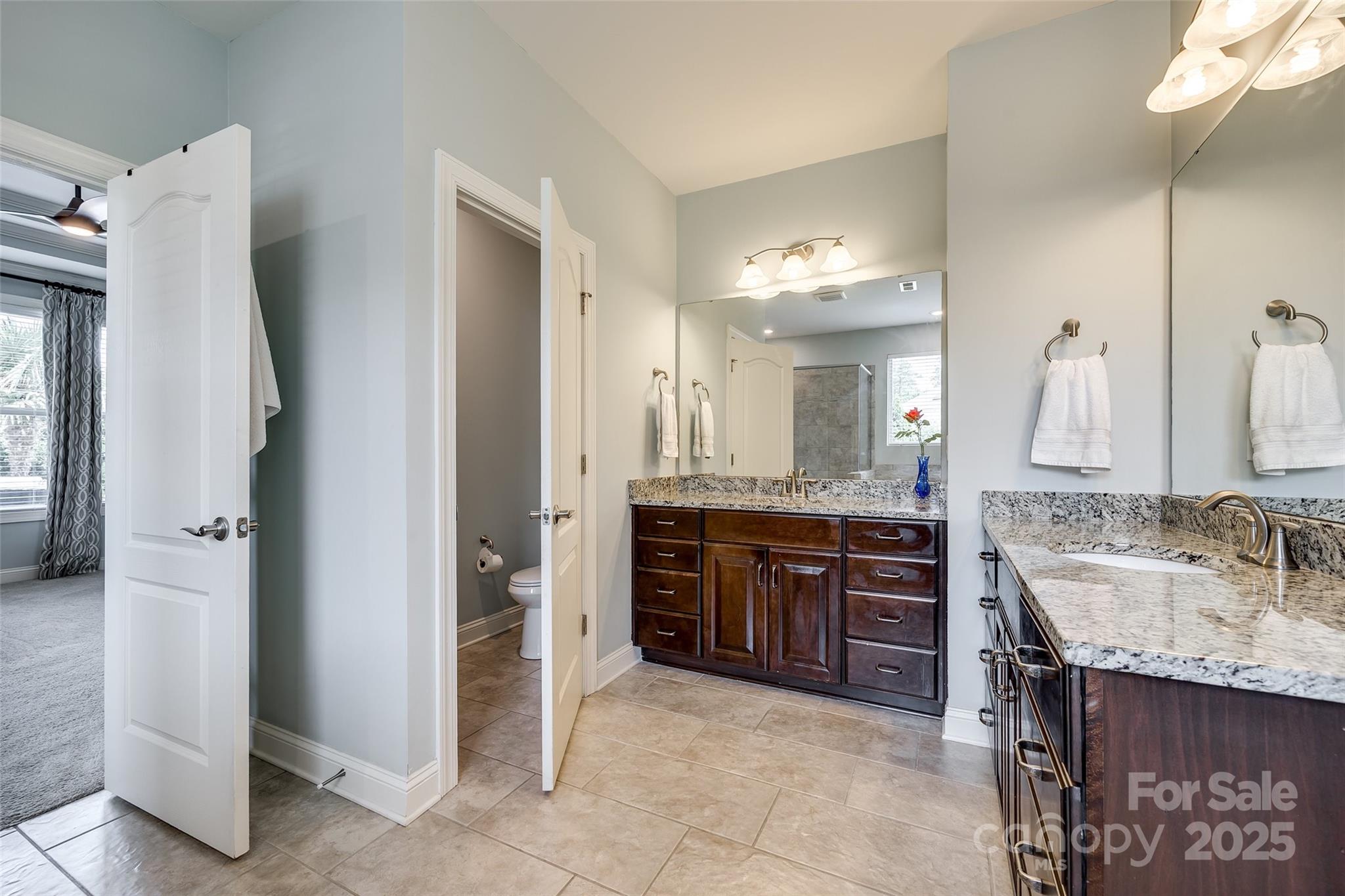 4220 Thames Circle Fort Mill, SC 29715 - Photo 18 of 44 a bathroom with a granite countertop sink and a mirror
