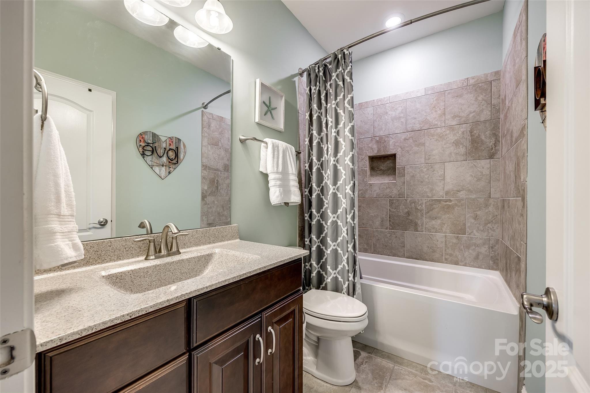 4220 Thames Circle Fort Mill, SC 29715 - Photo 26 of 44 a bathroom with a sink a toilet and a bathtub
