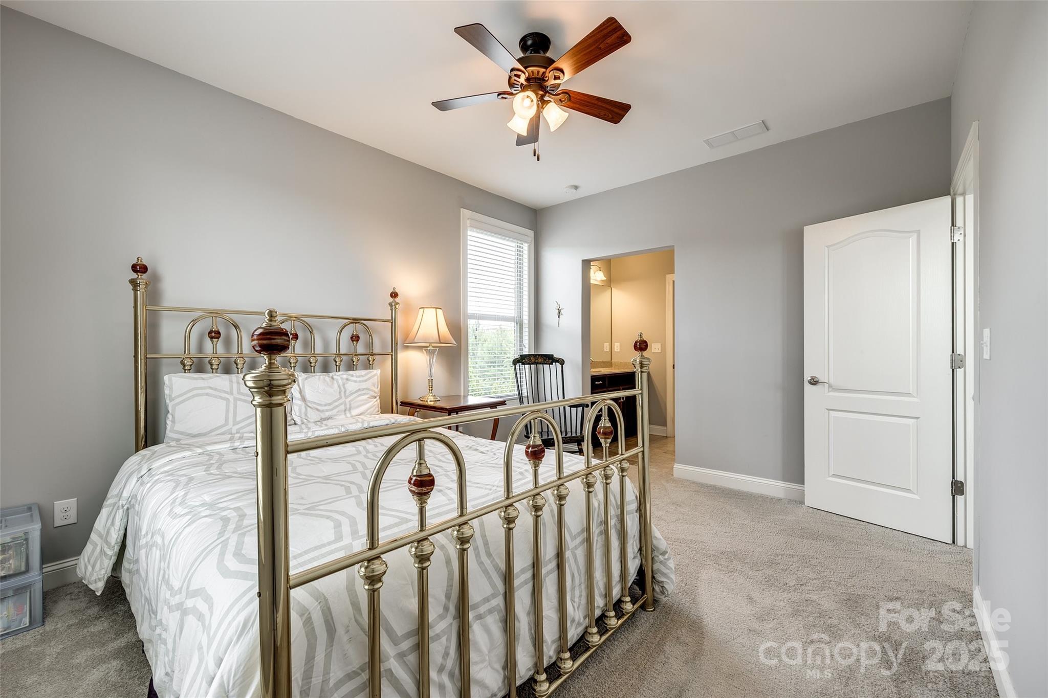 4220 Thames Circle Fort Mill, SC 29715 - Photo 28 of 44 a view of a bedroom with furniture and chandelier