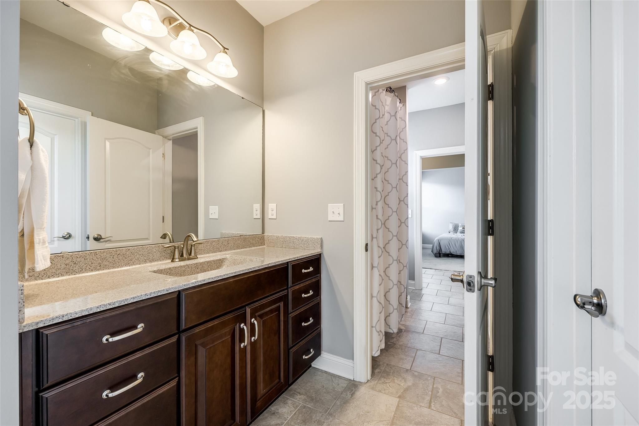 4220 Thames Circle Fort Mill, SC 29715 - Photo 31 of 44 a bathroom with a double vanity sink and mirror with shower