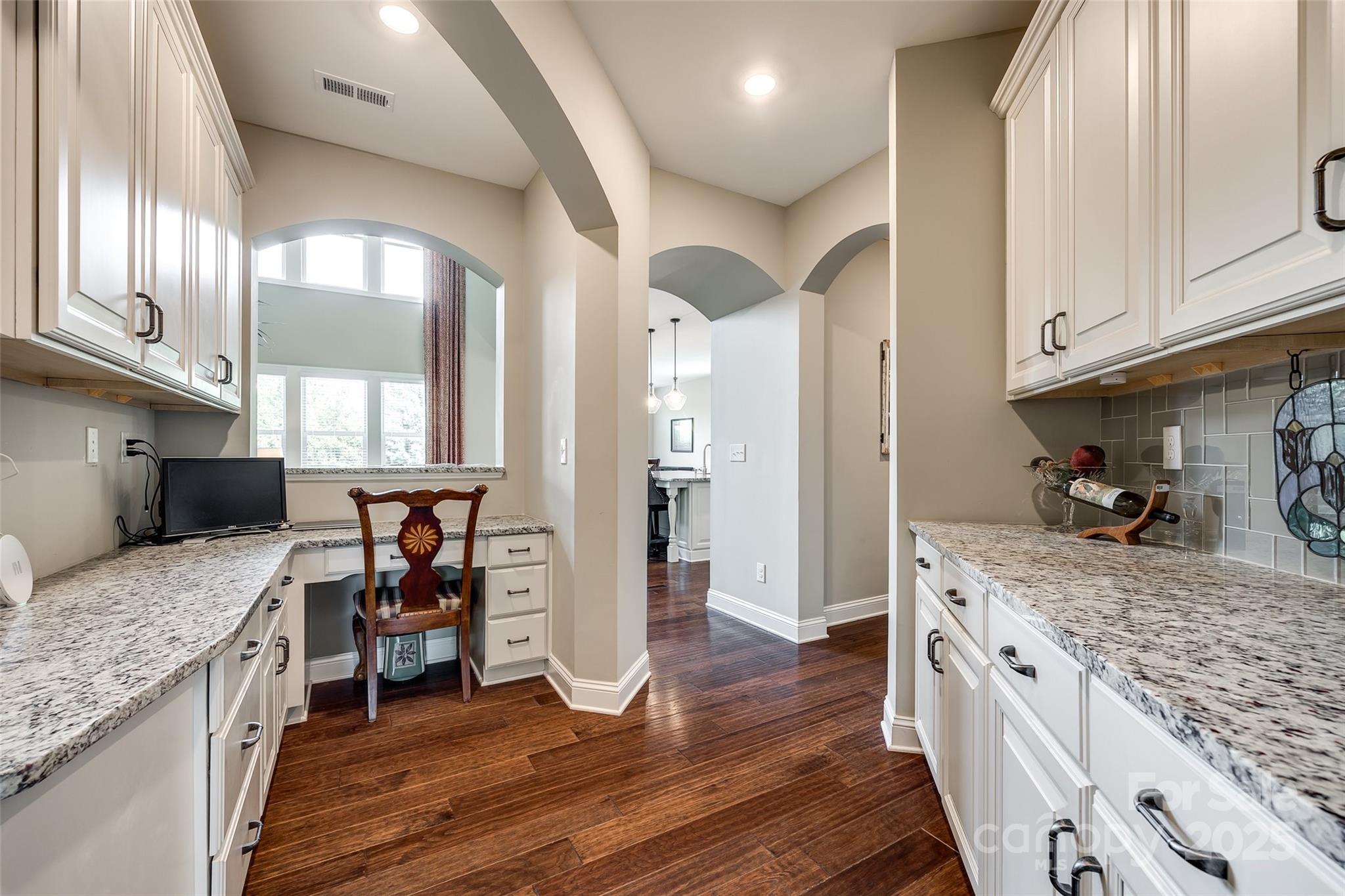 4220 Thames Circle Fort Mill, SC 29715 - Photo 9 of 44 a kitchen with stainless steel appliances granite countertop a refrigerator a stove and a wooden floors