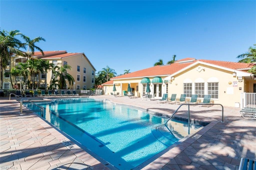 4635 St Croix Lane, Unit 1218 Naples, FL 34109 - Photo 24 of 40 Community pool featuring a patio area