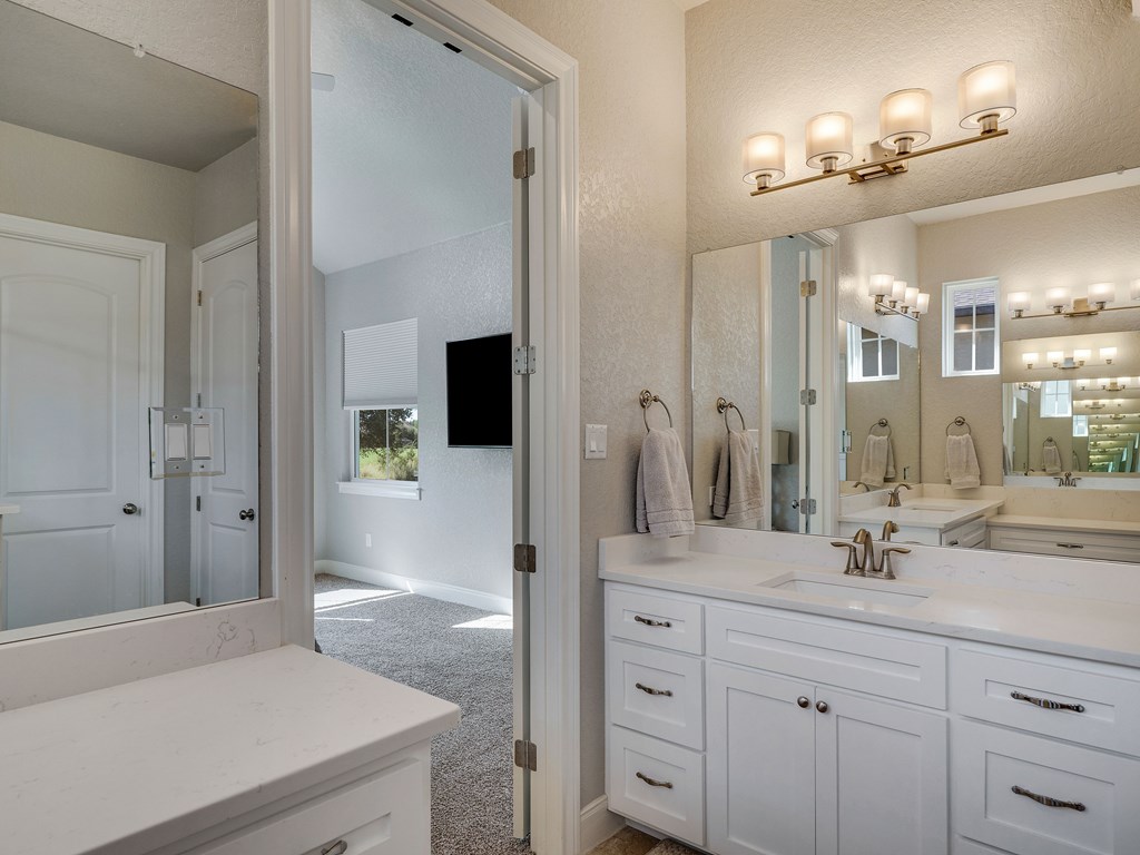 238 Roy Nichols Blanco, TX 78606 - Photo 16 of 25 a bathroom with a sink a mirror and a shower