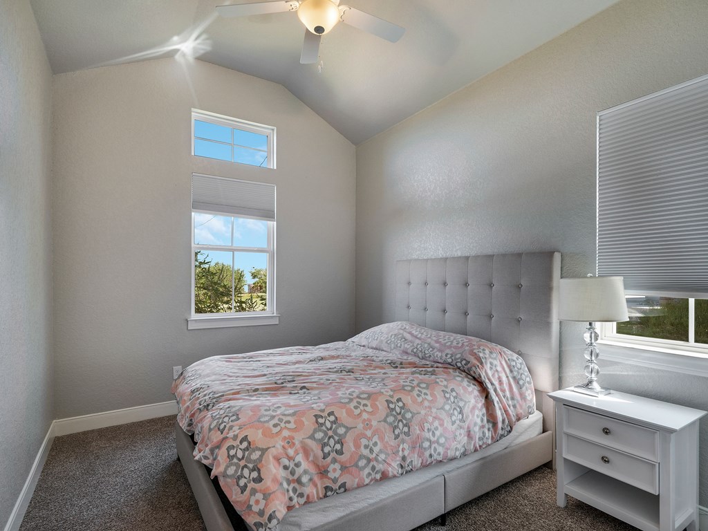 238 Roy Nichols Blanco, TX 78606 - Photo 19 of 25 a bedroom with a bed and a window