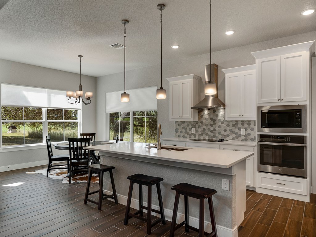 238 Roy Nichols Blanco, TX 78606 - Photo 8 of 25 a kitchen with counter space and windows