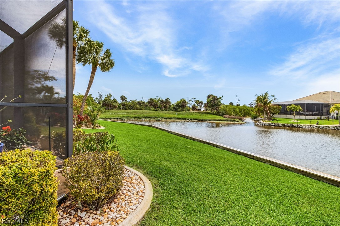 7747 Grande Pine Road Bokeelia, FL 33922 - Photo 39 of 45 a view of a lake with a yard