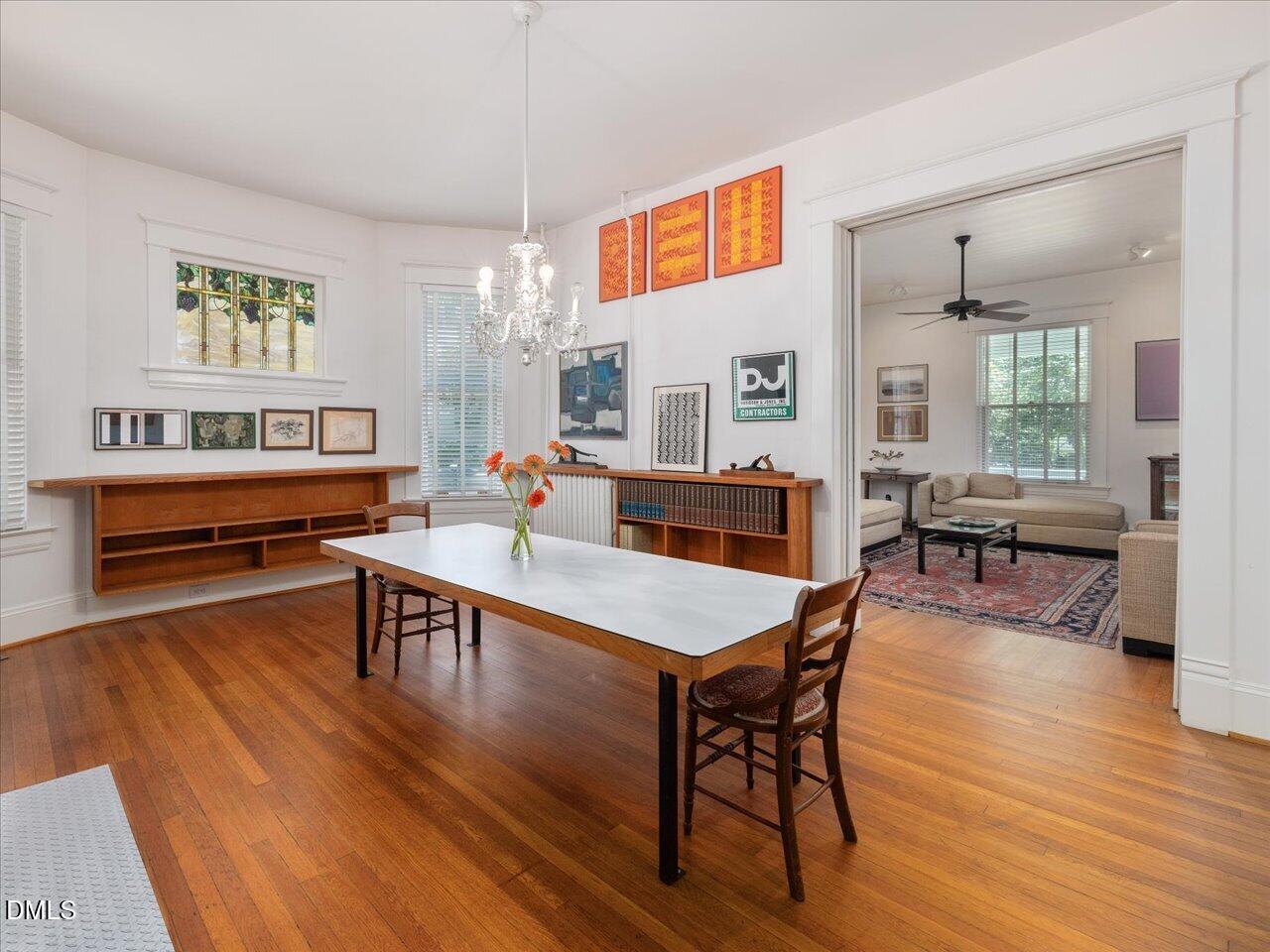 215 Hillcrest Road Raleigh, NC 27605 - Photo 35 of 97 a view of a dining room with furniture window and wooden floor